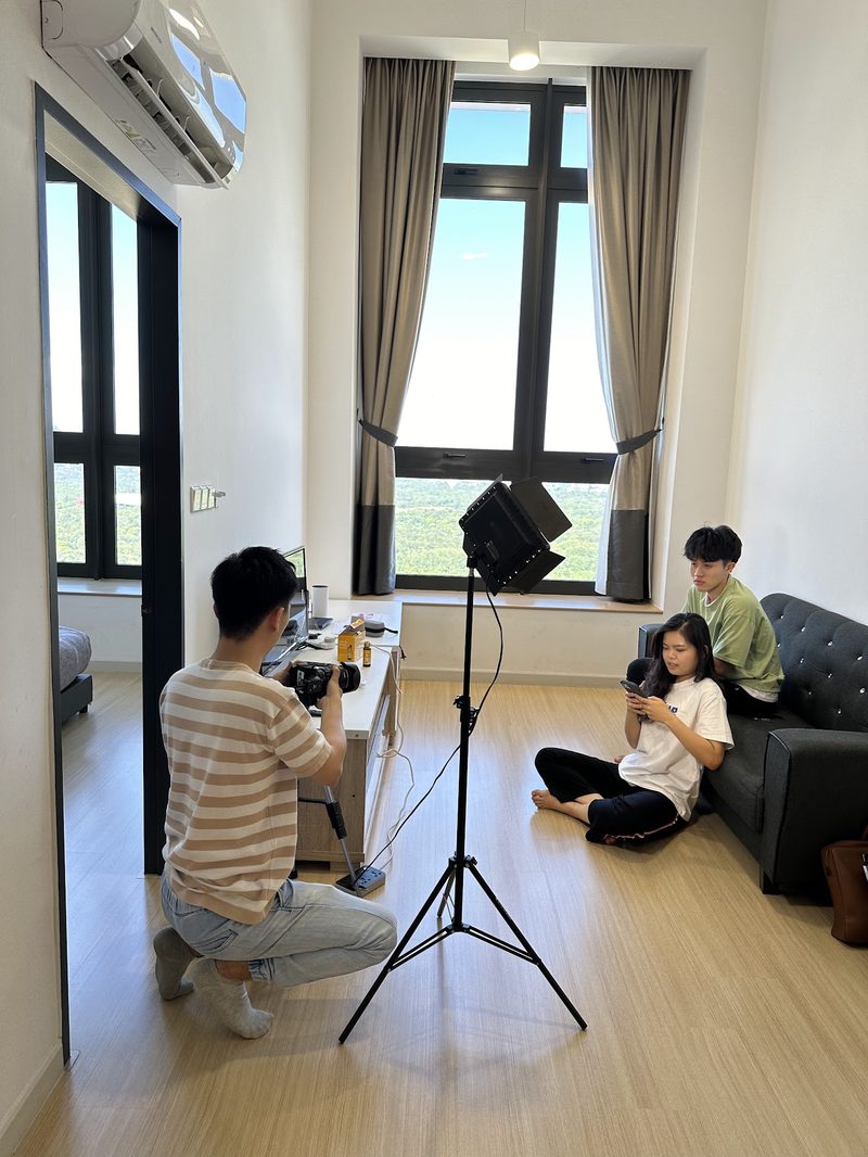 Filming a property ad with professional lighting