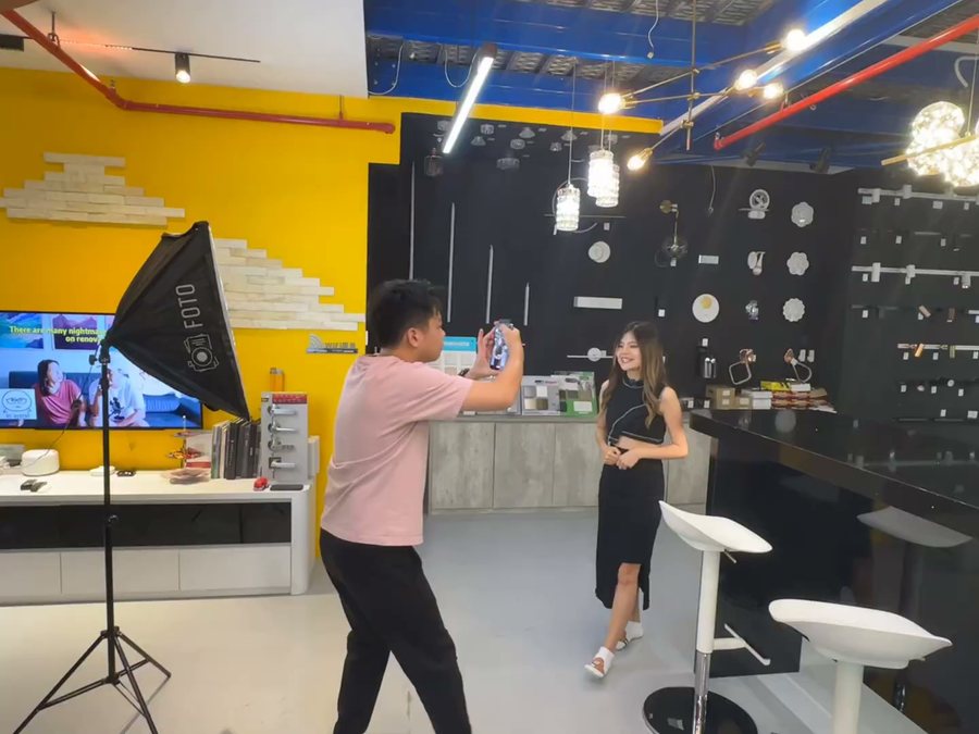 Filming a hardware showroom ad with professional lighting